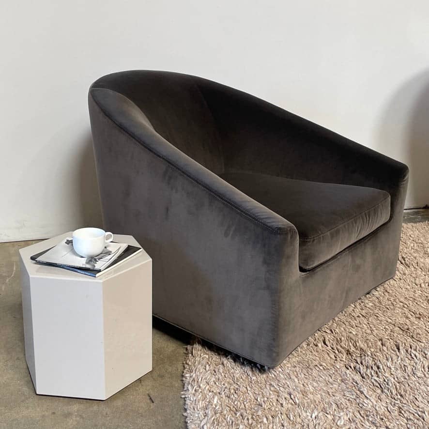 A Minotti Aeron side table on a white background.