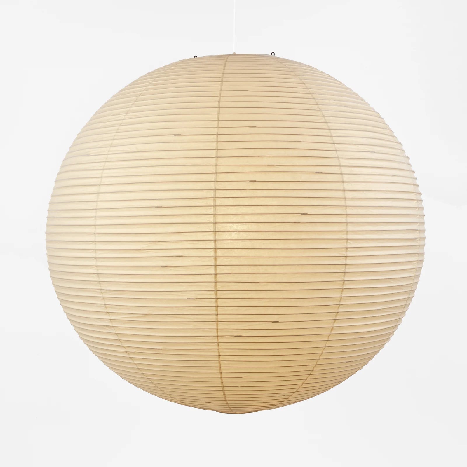 The Noguchi Akari 120A Suspension Lamp by Noguchi, a round beige paper lantern with horizontal ribbing, hangs against a plain white background, showcasing the timeless elegance of Japanese craftsmanship.