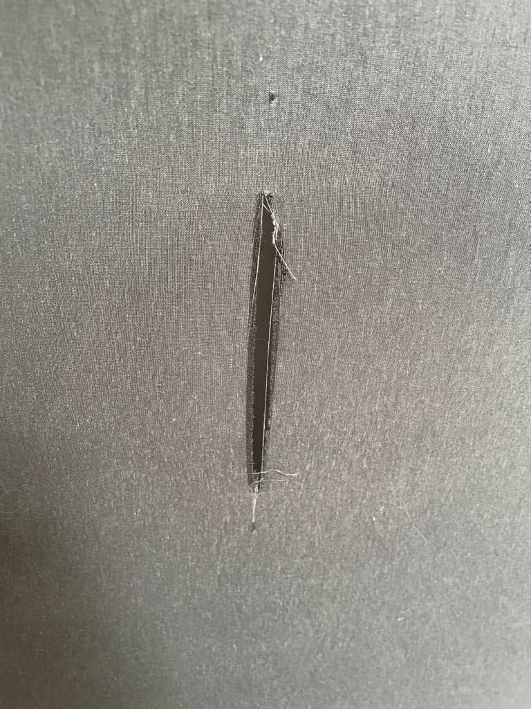 Modern curved Ligne Roset Yang Sectional sofa in durable wool fabric, isolated on a white background.