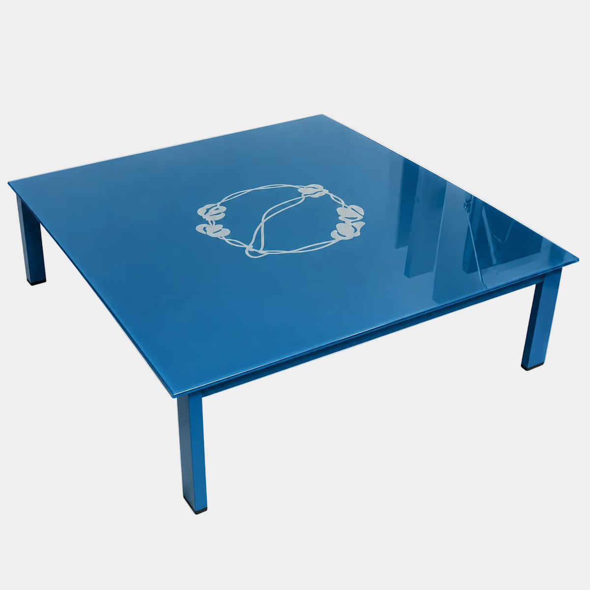 BD Barcelona Sevilla Coffee Table by BD Barcelona, a square coffee table in a reddish-brown hue with a glossy finish, features an intricate vine design at the center and a burgundy glass top. Photographed against a plain white background, this elegant piece combines sophisticated styling with fine craftsmanship.
