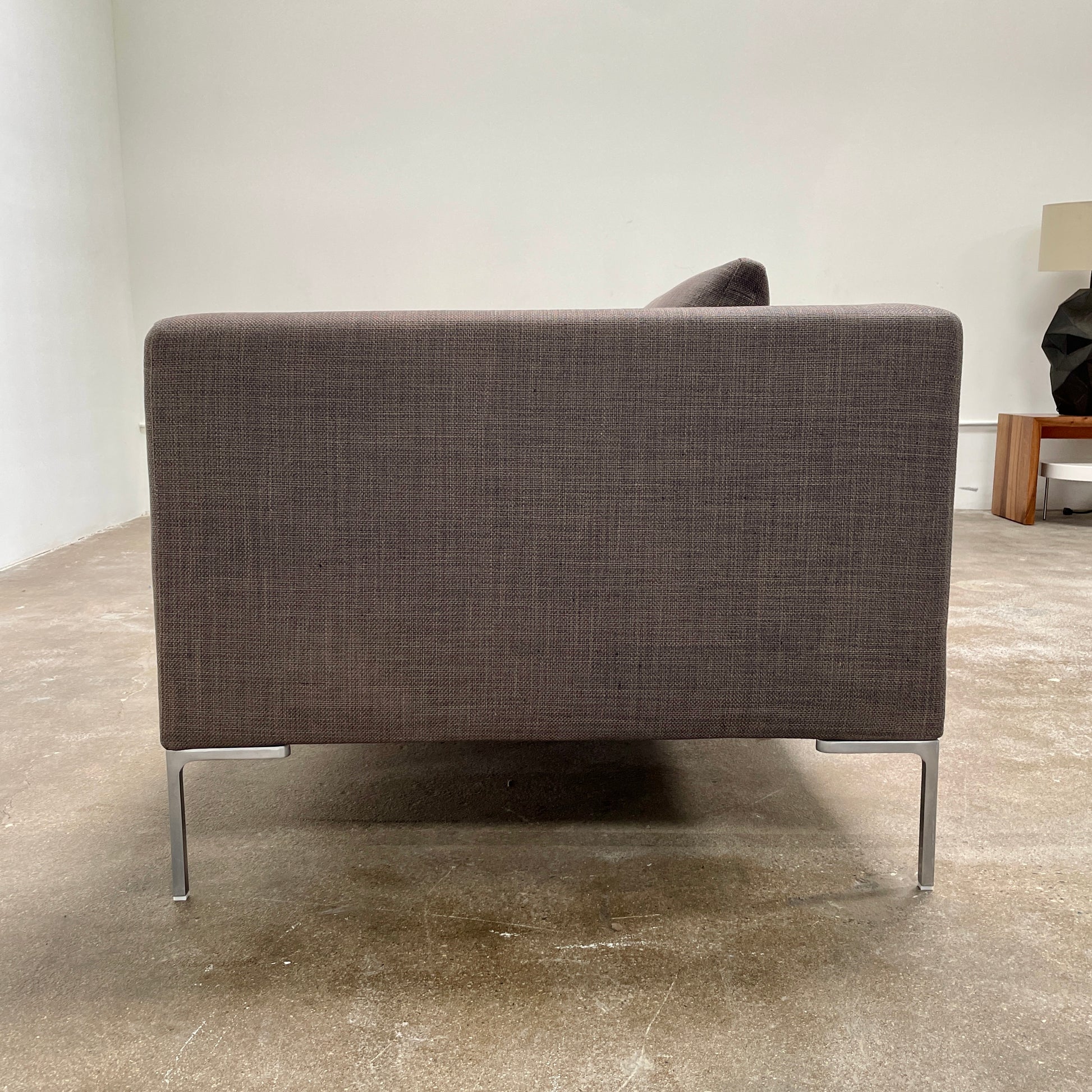 Elegant dark gray B&B Italia Charles Sofa with minimalist squared arms and two matching back cushions, showcased against a plain background.