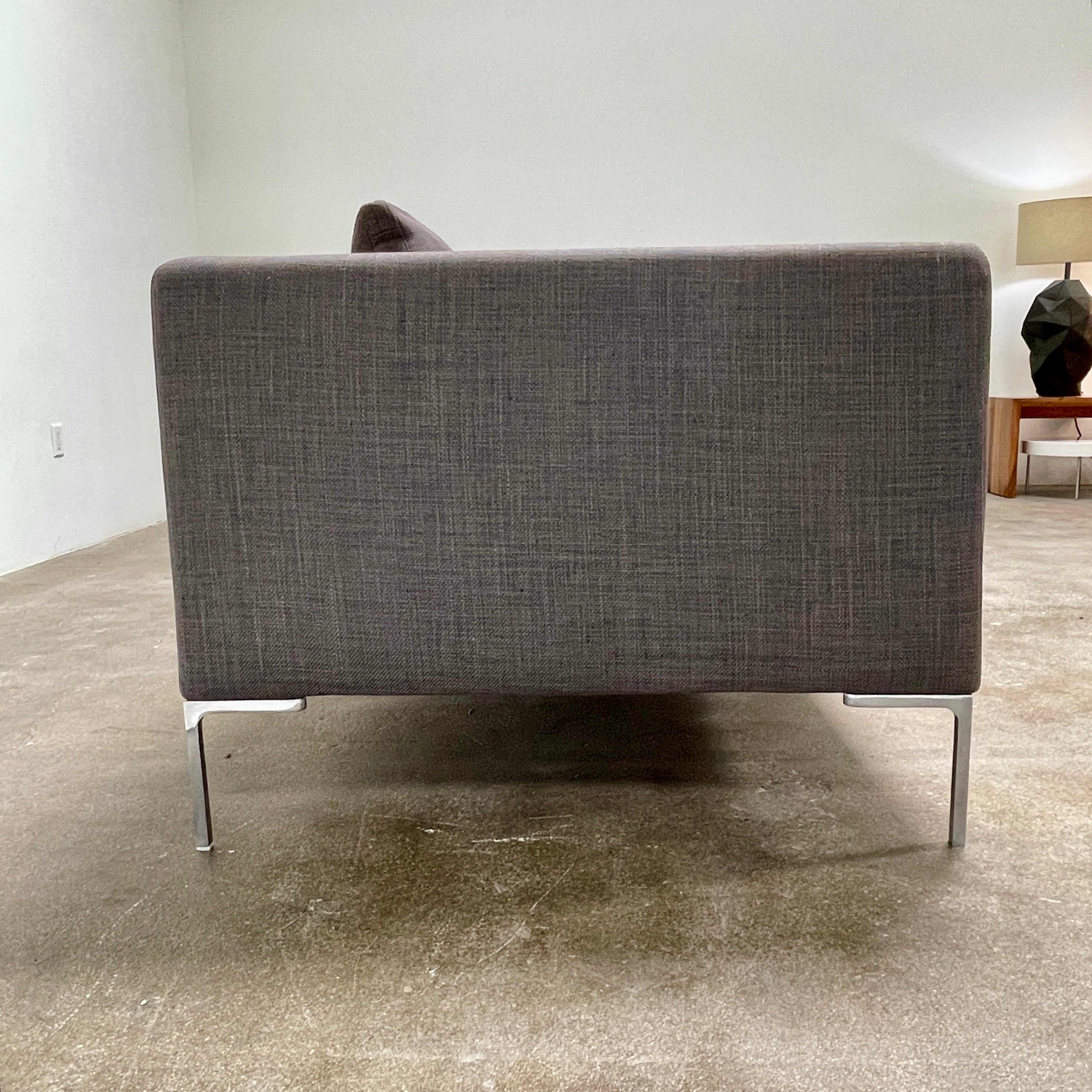 Elegant dark gray B&B Italia Charles Sofa with minimalist squared arms and two matching back cushions, showcased against a plain background.