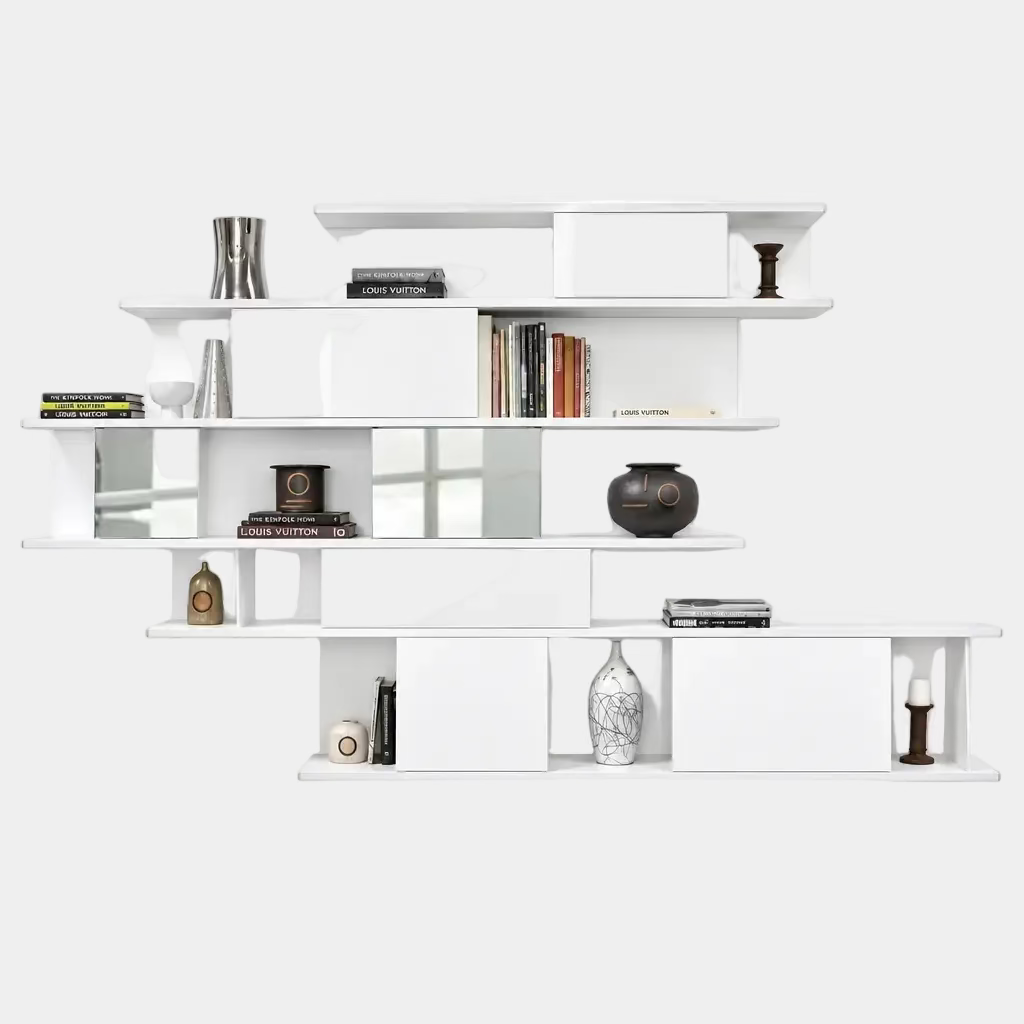 A white, wall-hanging B&B Italia Shift Wall Hanging Shelving System featuring horizontal tiers, enclosed cabinets, and assorted decorative objects and books to create a sculptured bookcase.