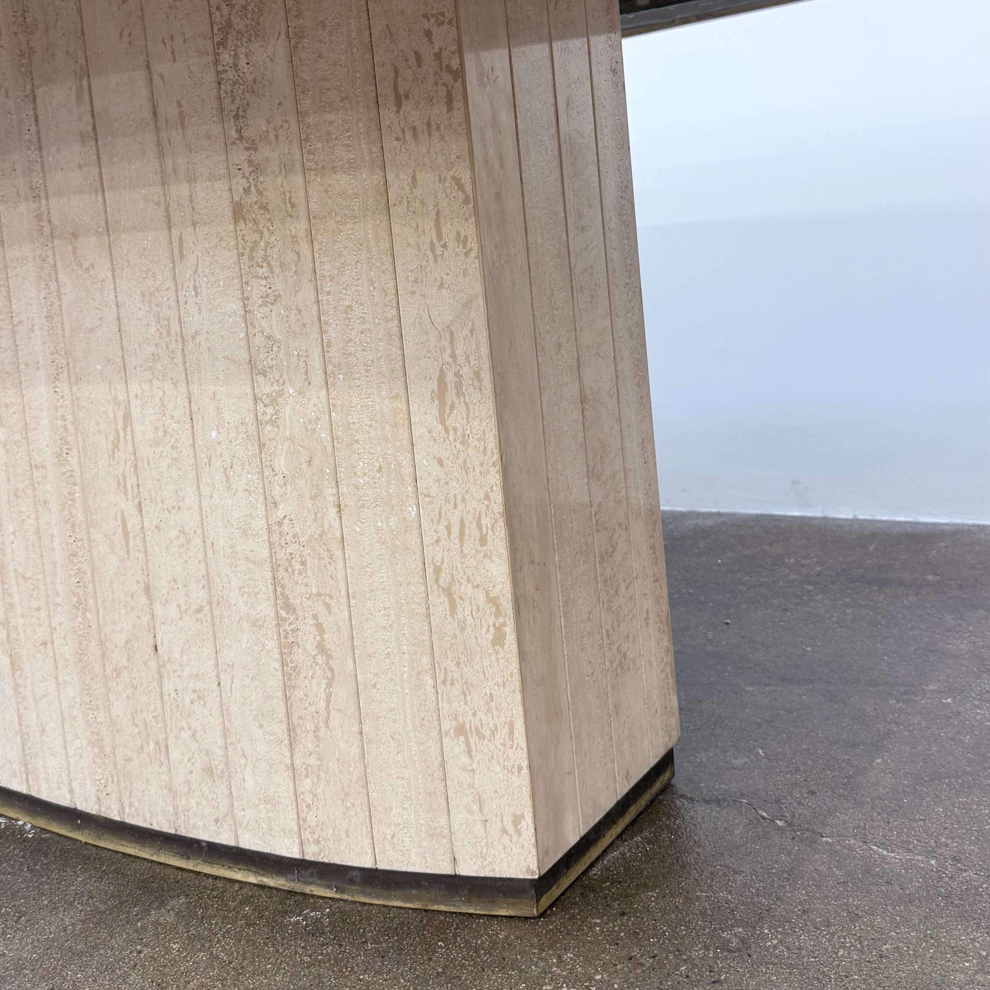 Rectangular Travertine and Brass Dining Table by Willy Rizzo with a brass edge inlay and a central column base.