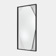 Rectangular wall mirror featuring a geometric, irregular octagonal silhouette set in a slim black metal frame against a minimalist backdrop—introducing the Ligne Roset Belize Mirror by Ligne Roset, an effortlessly modern statement piece for any space.