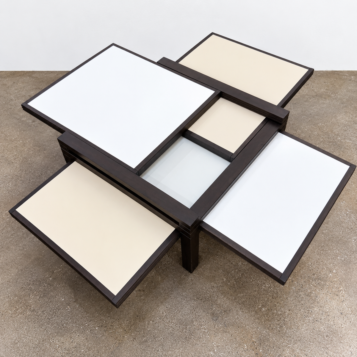 Bellato Hexa Expandable Coffee Table featuring an 1980s-style solid wood frame with multiple white and cream sliding panels extending from the center.