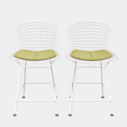 Two white Knoll Harry Bertoia Wire Counter Stools with light green seat cushions.