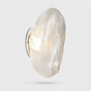 Bocci 73sp Clear Glass Surface Light with an irregularly shaped, translucent, and textured organic surface.