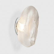A Bocci 73sp Clear Glass Surface Light with an organic, irregularly shaped form and a textured mesh interior that creates a handcrafted surface light effect.