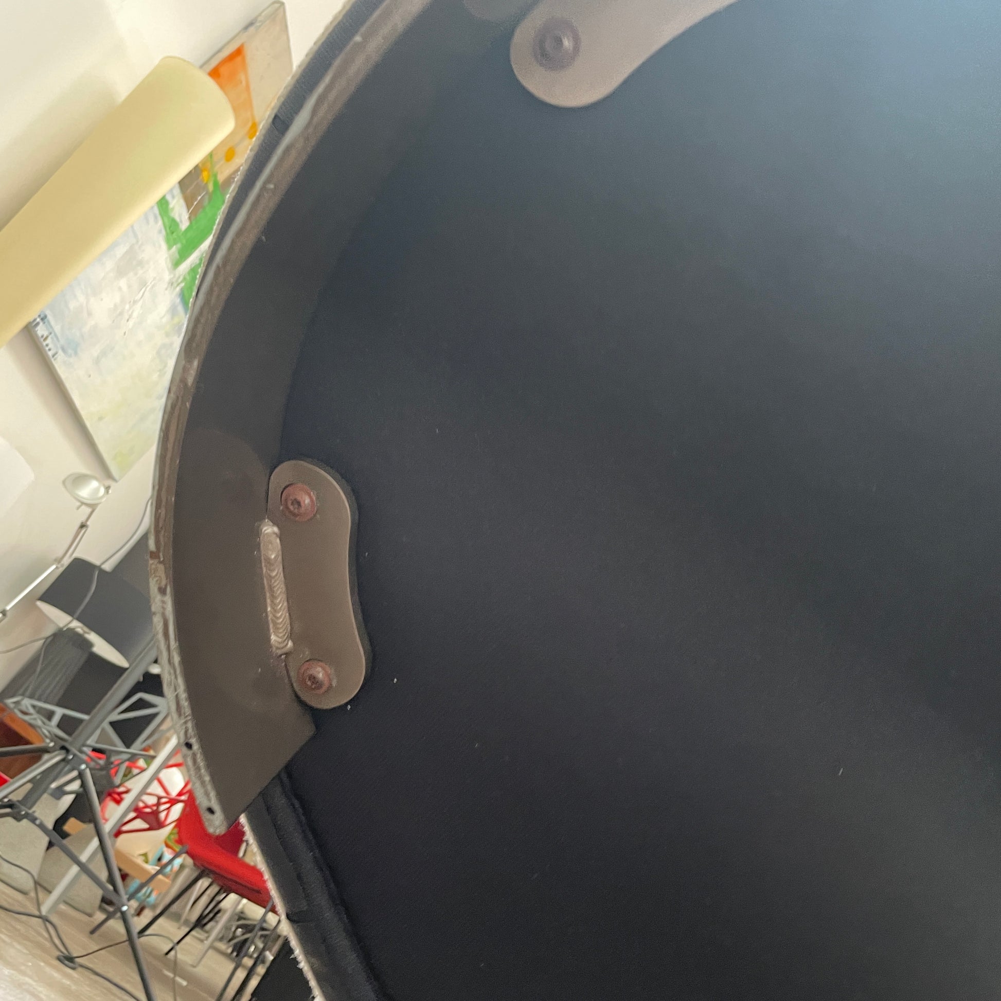 A Minotti Jacques Curved Sofa in white, featuring a contemporary design with curved lines and accompanied by two matching pillows, stands against a neutral background.