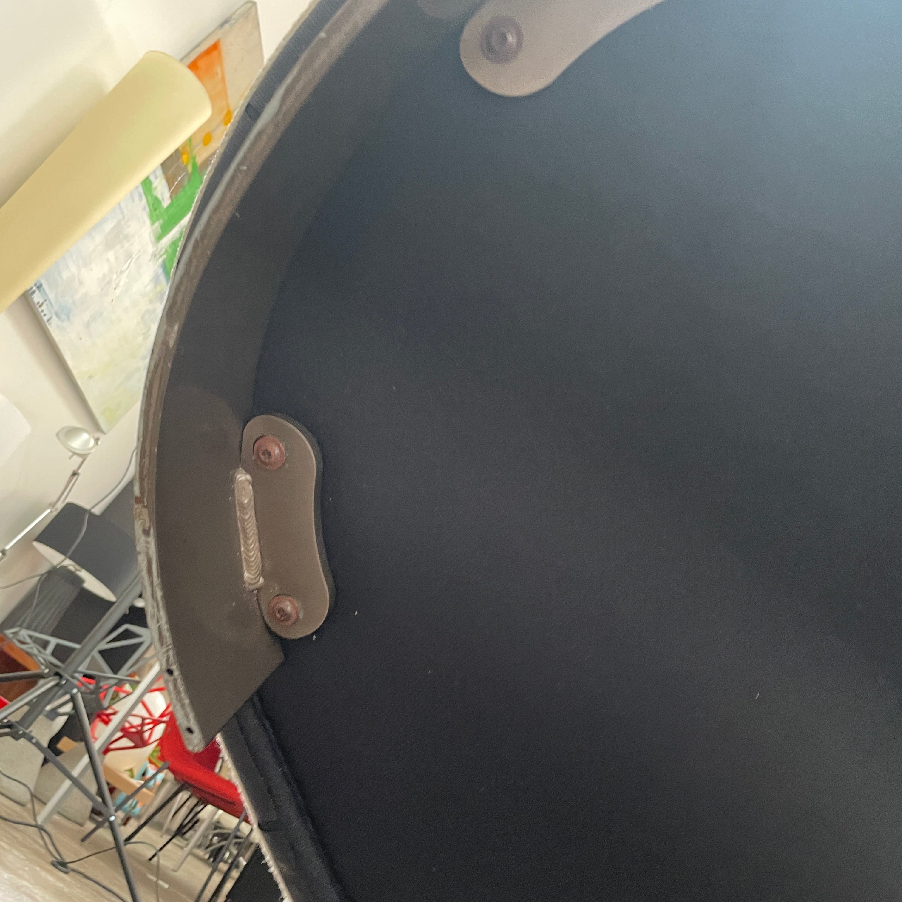 A Minotti Jacques Curved Sofa in white, featuring a contemporary design with curved lines and accompanied by two matching pillows, stands against a neutral background.