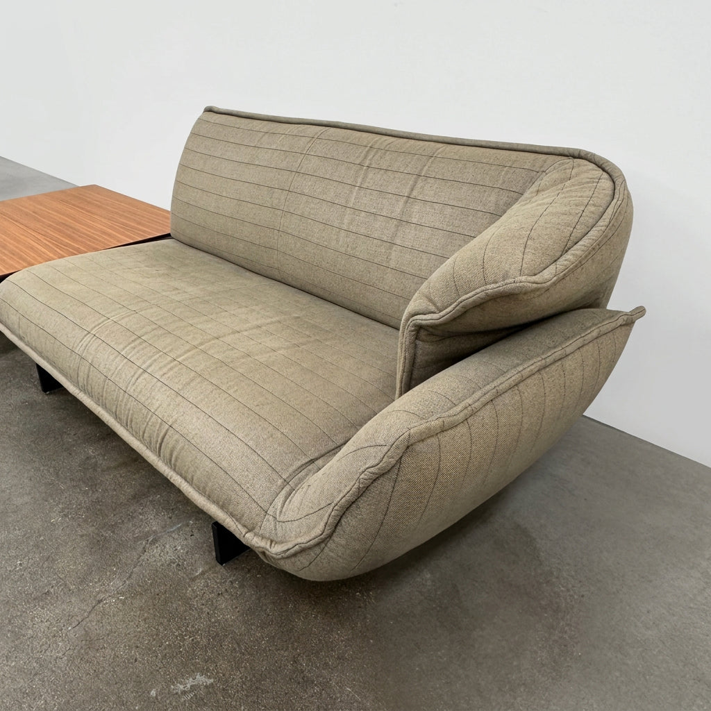 Two tan upholstered Cassina Beam Sectional Sofa with Corner Table sections connected by a rectangular wooden corner table.