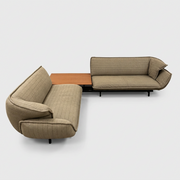 Two tan upholstered Cassina Beam Sectional Sofa with Corner Table sections connected by a rectangular wooden corner table.