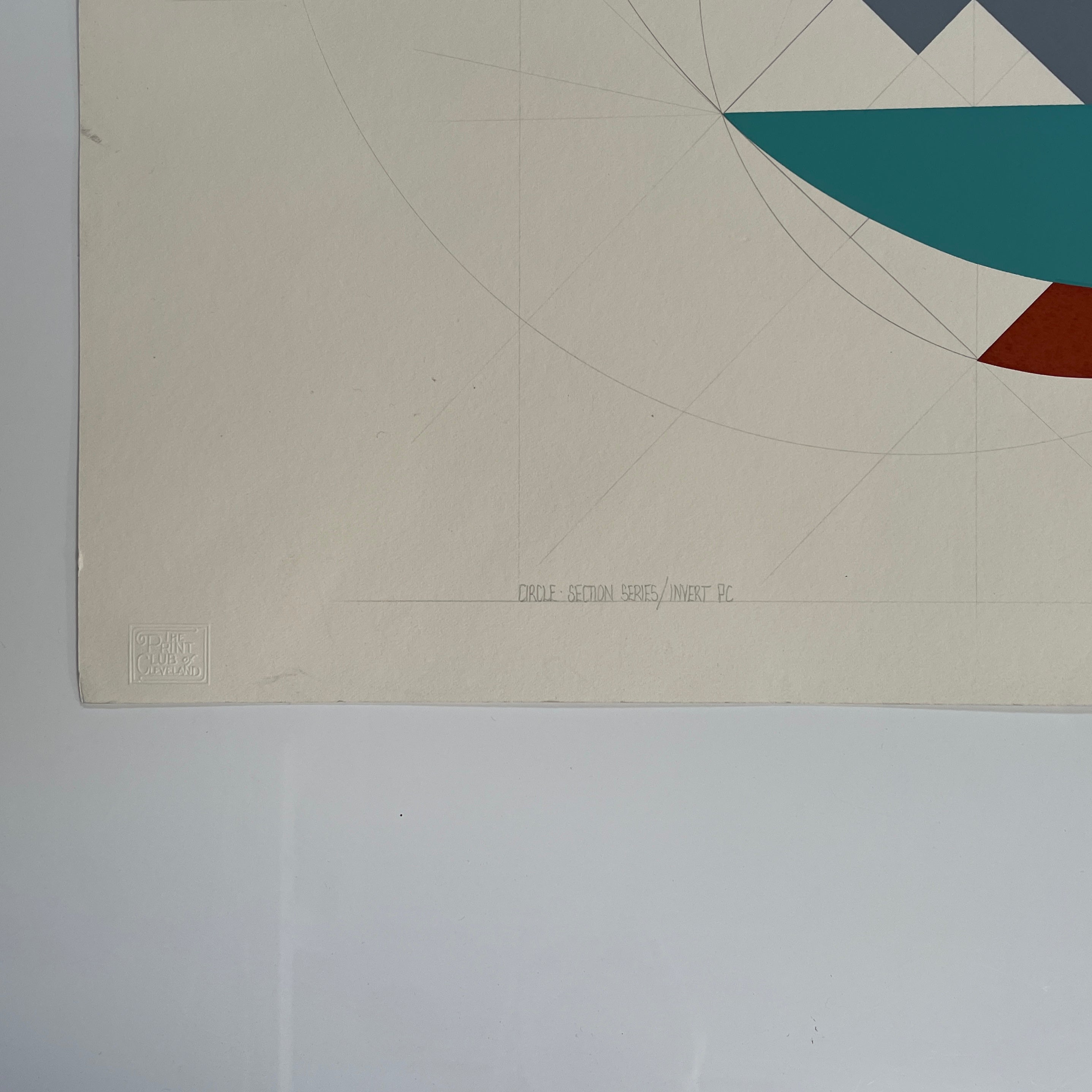 The John Pearson Circle-Section Series / Invert PC 1984 features abstract geometric artwork with overlapping red, teal, and brown shapes on a light background. Enhancing the composition is a subtle circular grid pattern, and John Pearson's signature can be seen at the bottom right.