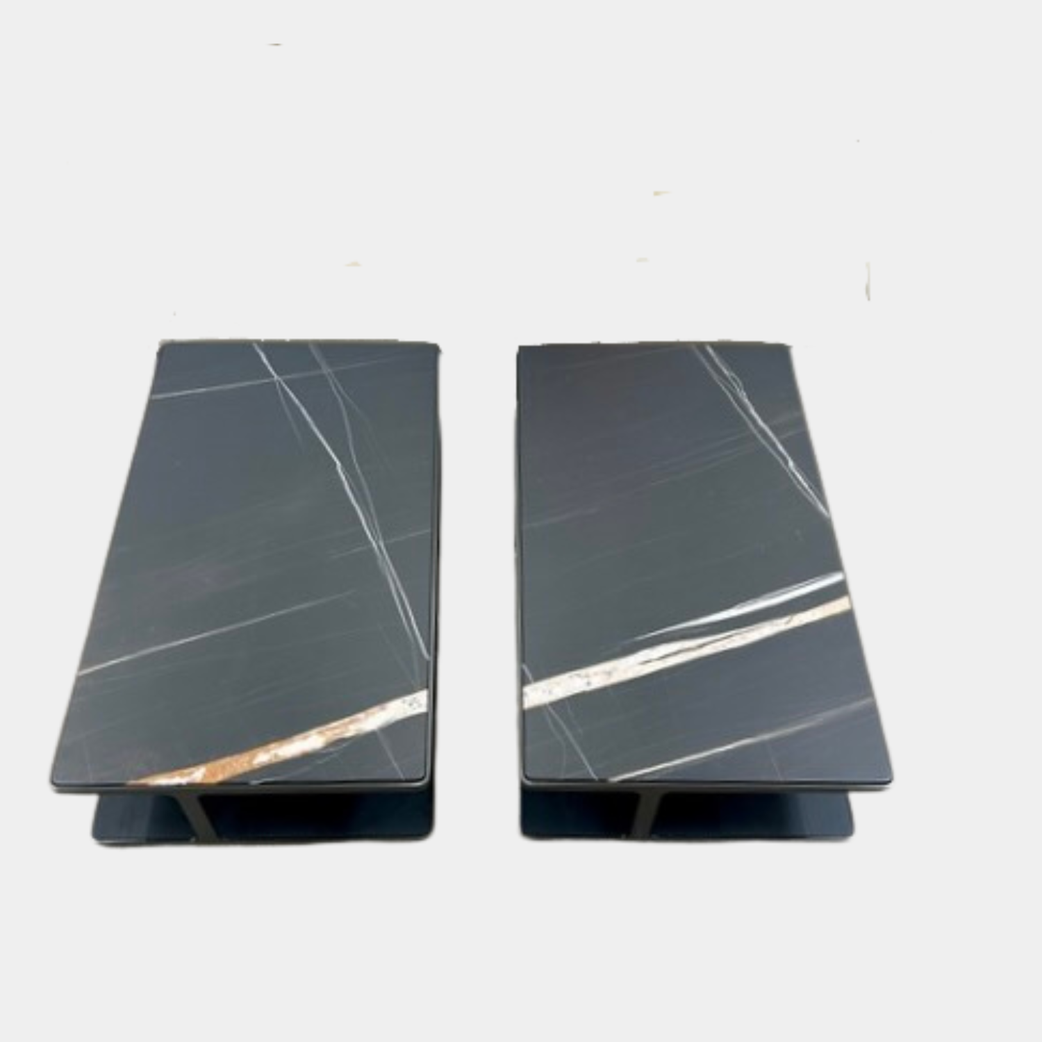 The Poliform Creek Marble Coffee Table is a rectangular Sahara Noir marble piece with a thin, horizontal design and subtle veining.