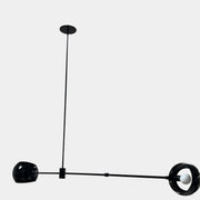 The David Weeks Studio Abaca Suspension Light is a custom-made, black, modern hanging fixture with two spherical bulbs. Crafted from powder-coated steel, it elegantly suspends from ceilings with exposed beams to add sophistication to any space.