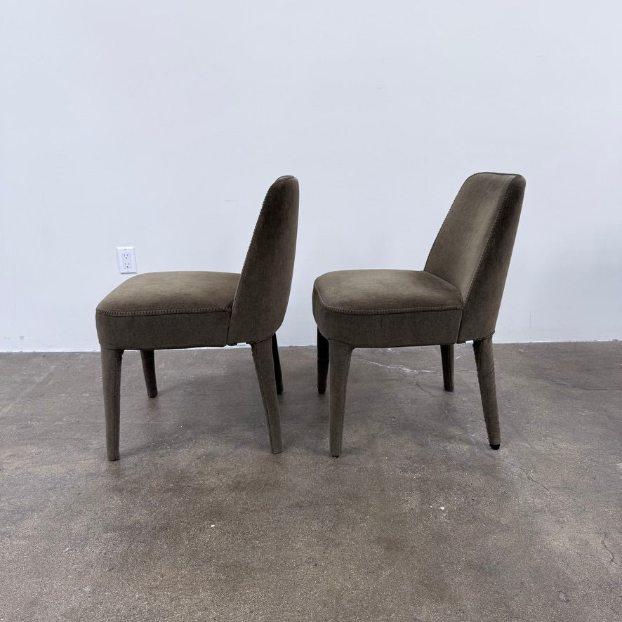 Two dark gray Maxalto Febo dining chairs with backrests, leather upholstery, and four tapered legs.