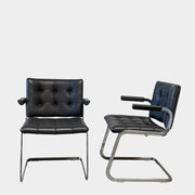 A pair of De Sede RH-305 Dining Chairs, perfect for seating comfort in any living space.
