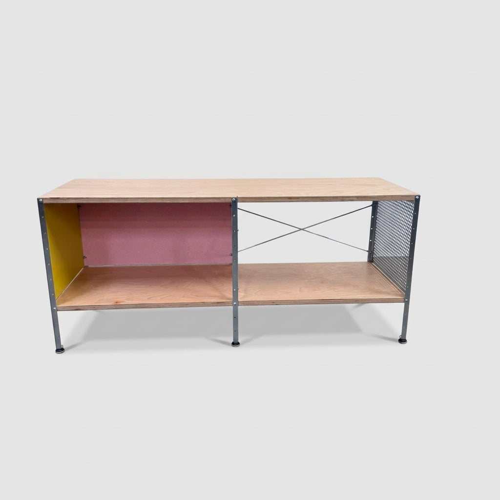Herman Miller Eames Storage Unit featuring a low rectangular frame with plywood shelves, a yellow side panel, a pink back panel, and a perforated metal side.