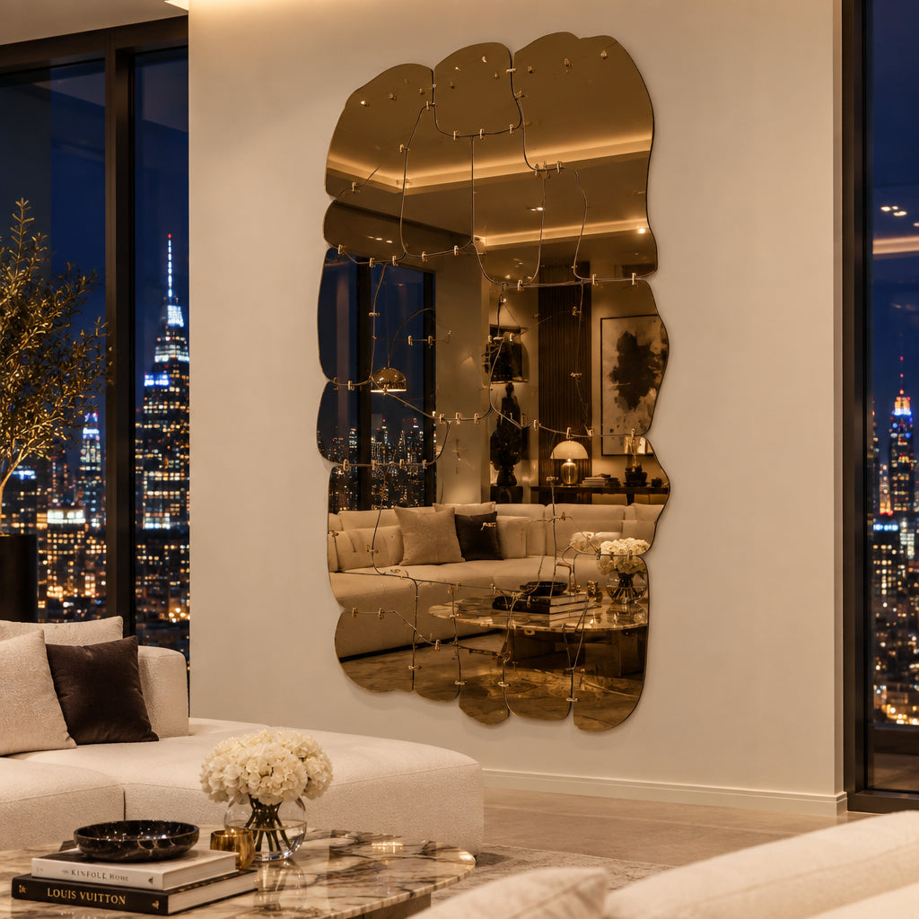 The Edra Miraggio Mirror by Edra features irregular, gold-toned metal panels with visible fasteners, mounted on a white background to highlight its artisanal craftsmanship.