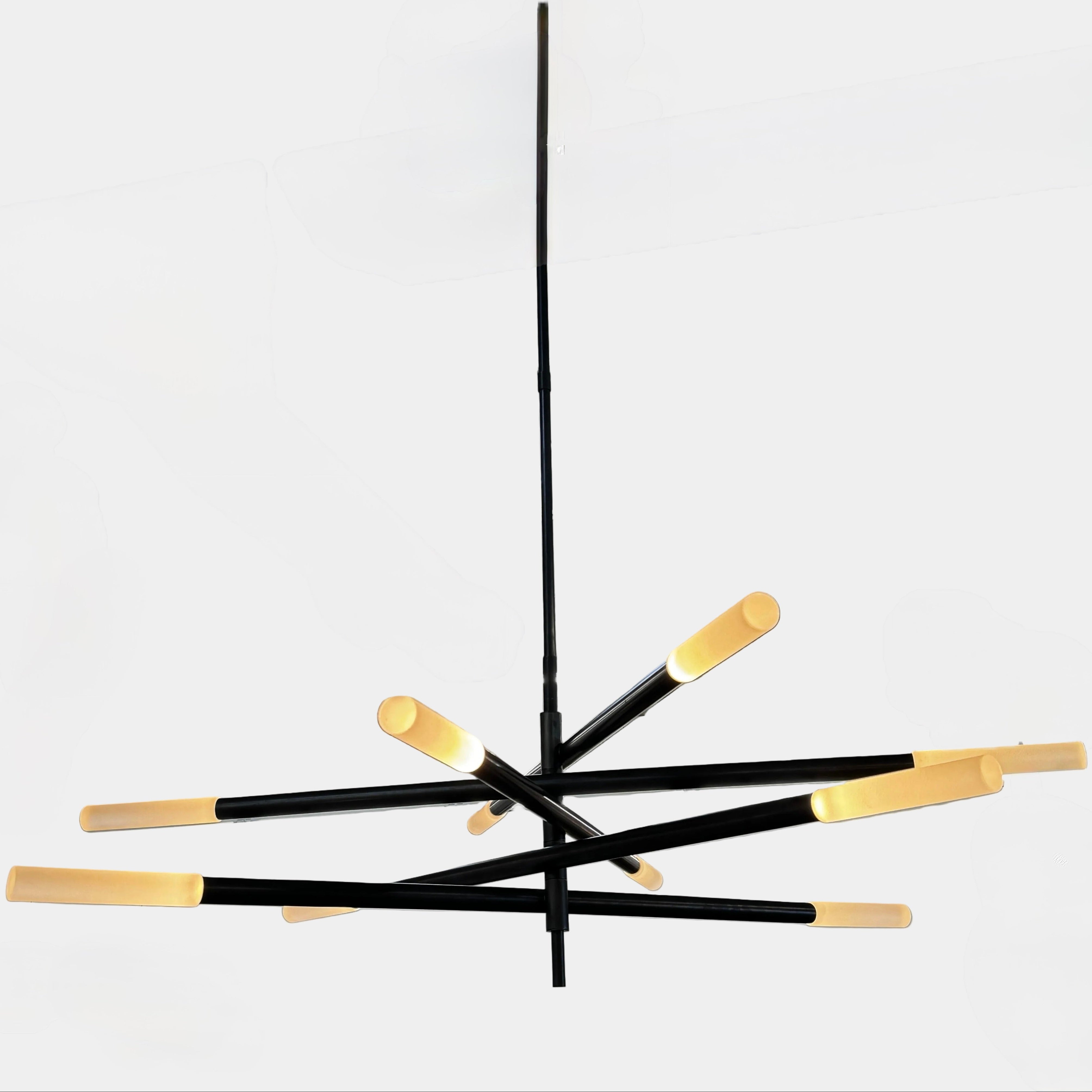 The Visual Comfort Signature Rousseau Grande Ten Light Articulating Chandelier features a modern black design with ten horizontal arms, each ending in a yellow-toned rectangular light, suspended from a central black rod against a white background.