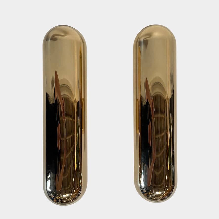 A pair of Ozone Gélule wall sconces on a white background, offering timeless elegance and sophisticated lighting solutions.