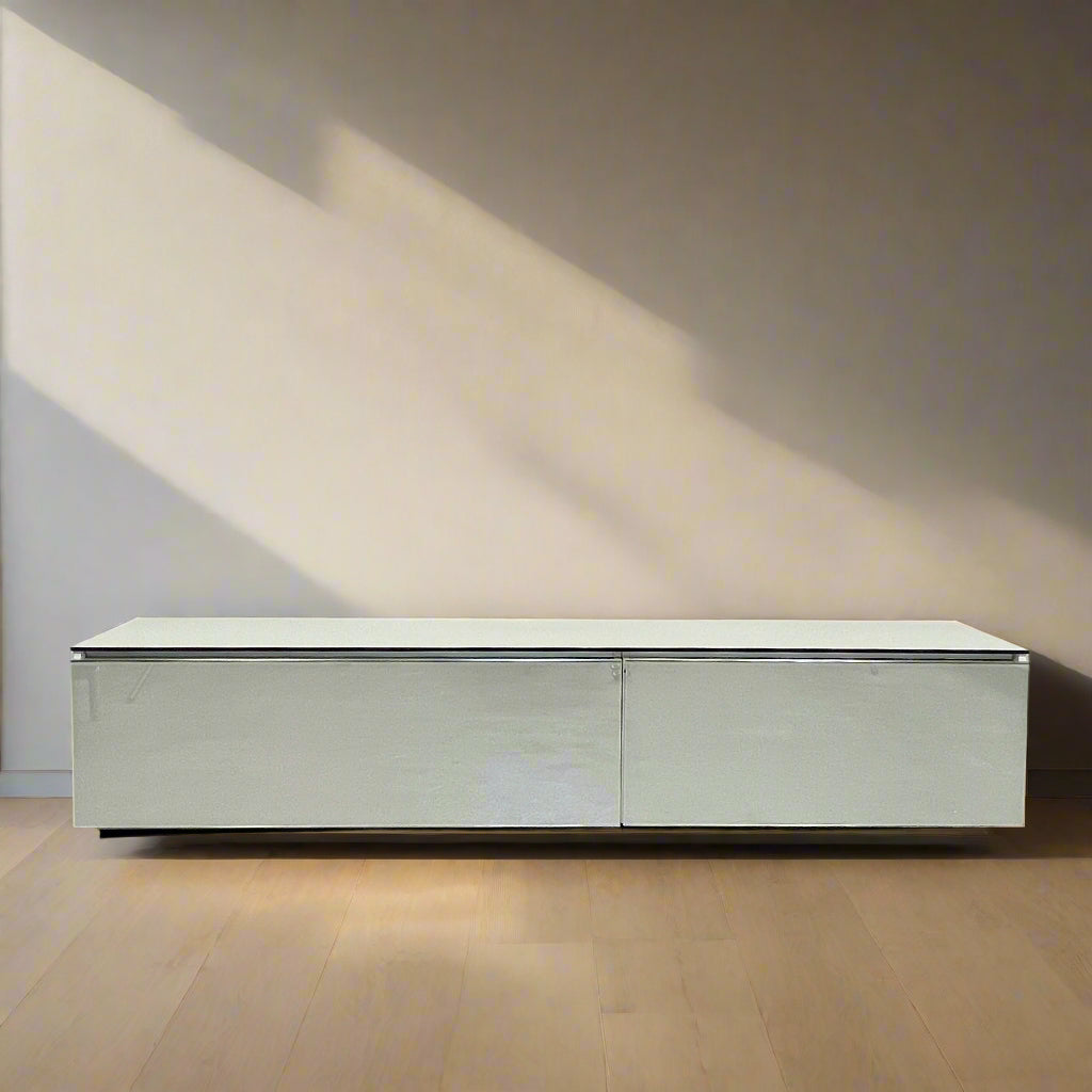 The B&B Italia Pab Low Console by B&B Italia is a rectangular, low-profile media console with glossy pearl white doors and two doors, perfect for stylish storage, shown against a plain white background.