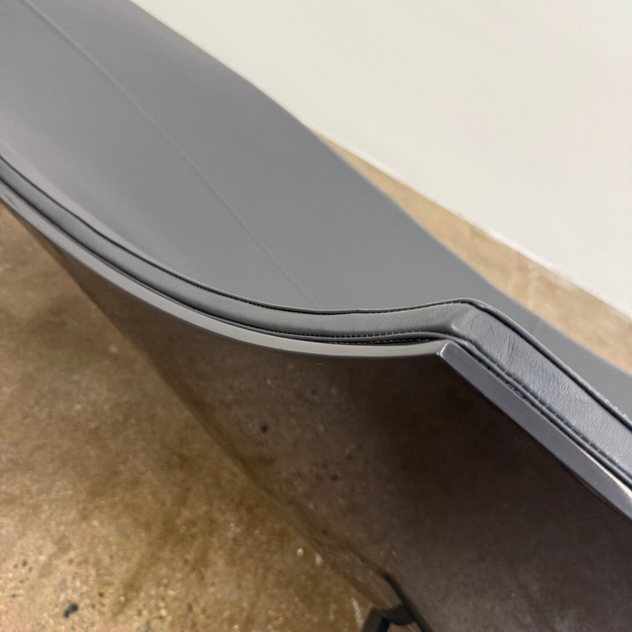 The B&B Italia Terminal 1 Lounge is a modern black bench with Jean-Marie Massaud’s sculpted, wave-like seat, a raised central backrest, and a minimalist black metal frame by B&B Italia.