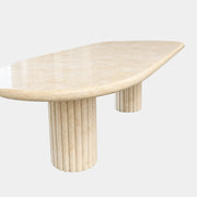 Form LA Fluta Oval Dining Table in Crema Marfil with a smooth top and two fluted cylindrical pedestals inspired by Roman architecture.