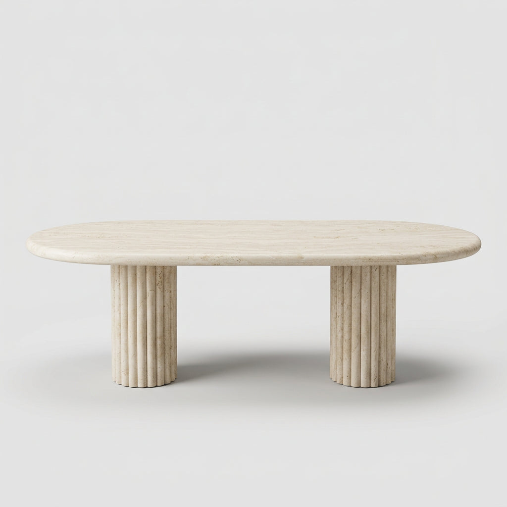 Form LA Fluta Oval Dining Table in Crema Marfil with a smooth top and two fluted cylindrical pedestals inspired by Roman architecture.