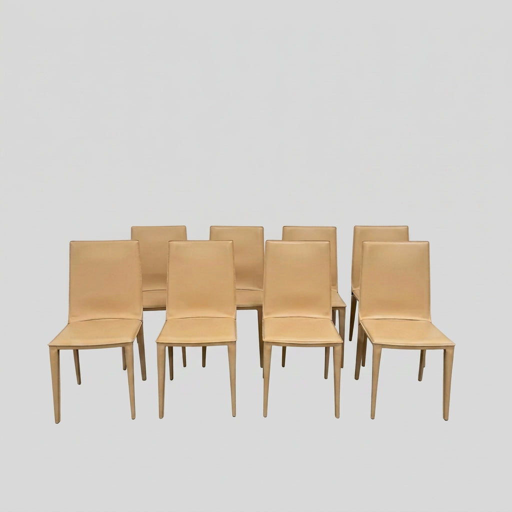 Eight light-tan Frag Bottega leather dining chairs arranged in two rows.