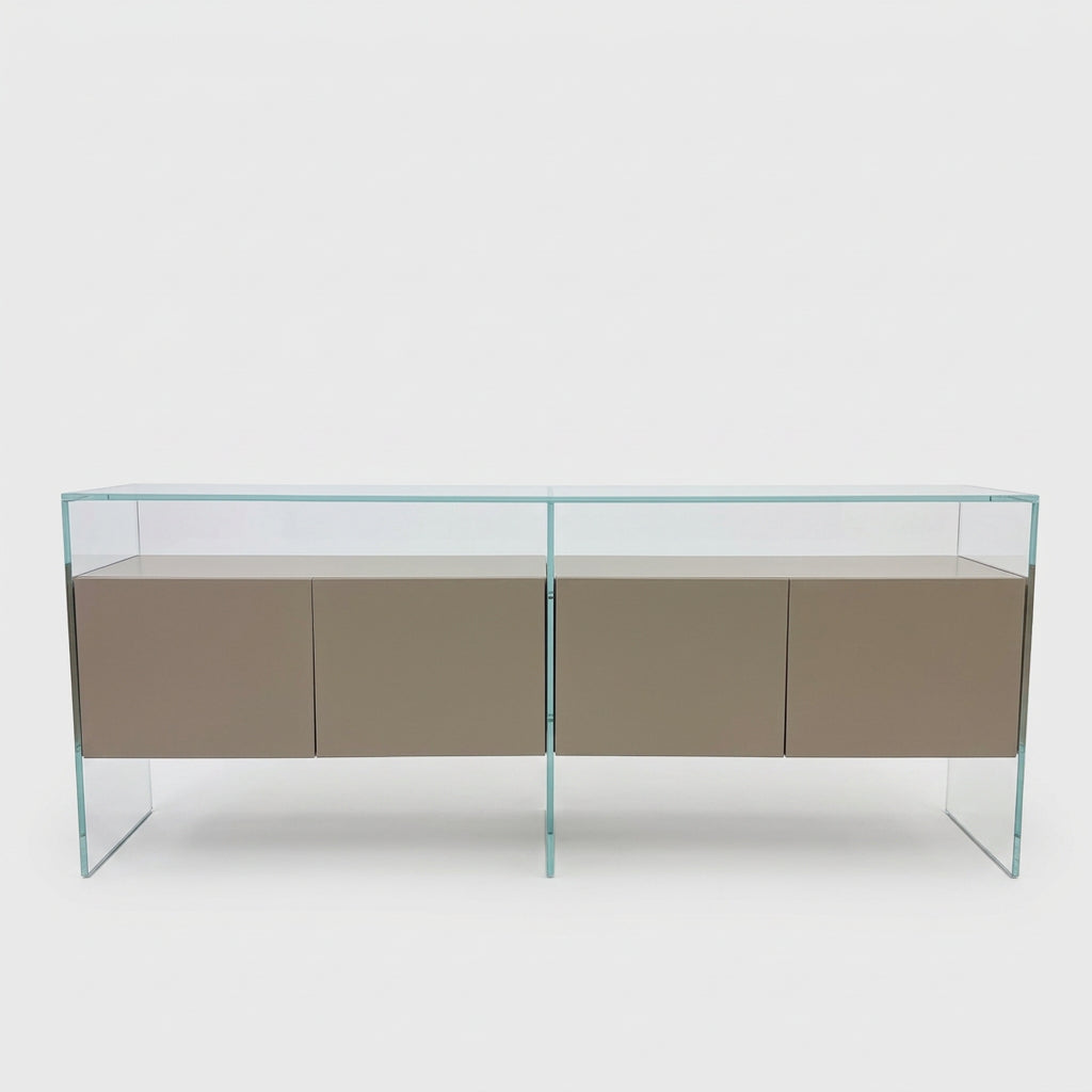A long Gallotti & Radice Air Console Table featuring a clear glass frame and four opaque taupe storage cabinets.