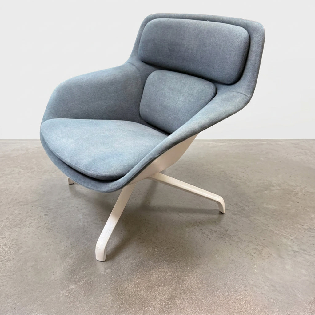 Blue upholstered Herman Miller Striad Lounge Chair Mid Back with a low back and four-pronged metal base.