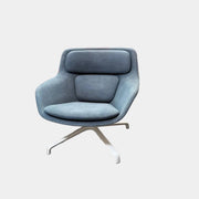 Blue upholstered Herman Miller Striad Lounge Chair Mid Back with a low back and four-pronged metal base.