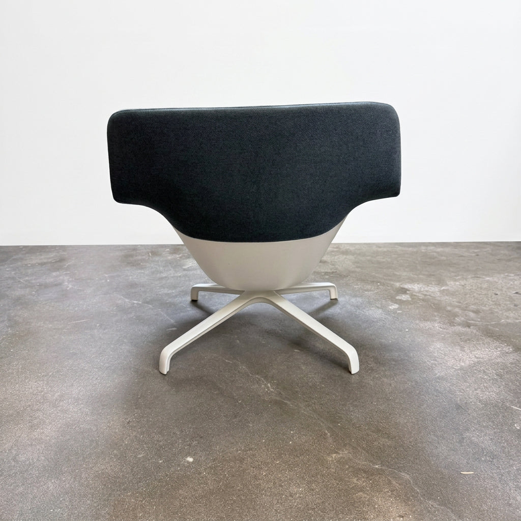 Blue upholstered Herman Miller Striad Lounge Chair Mid Back with a low back and four-pronged metal base.
