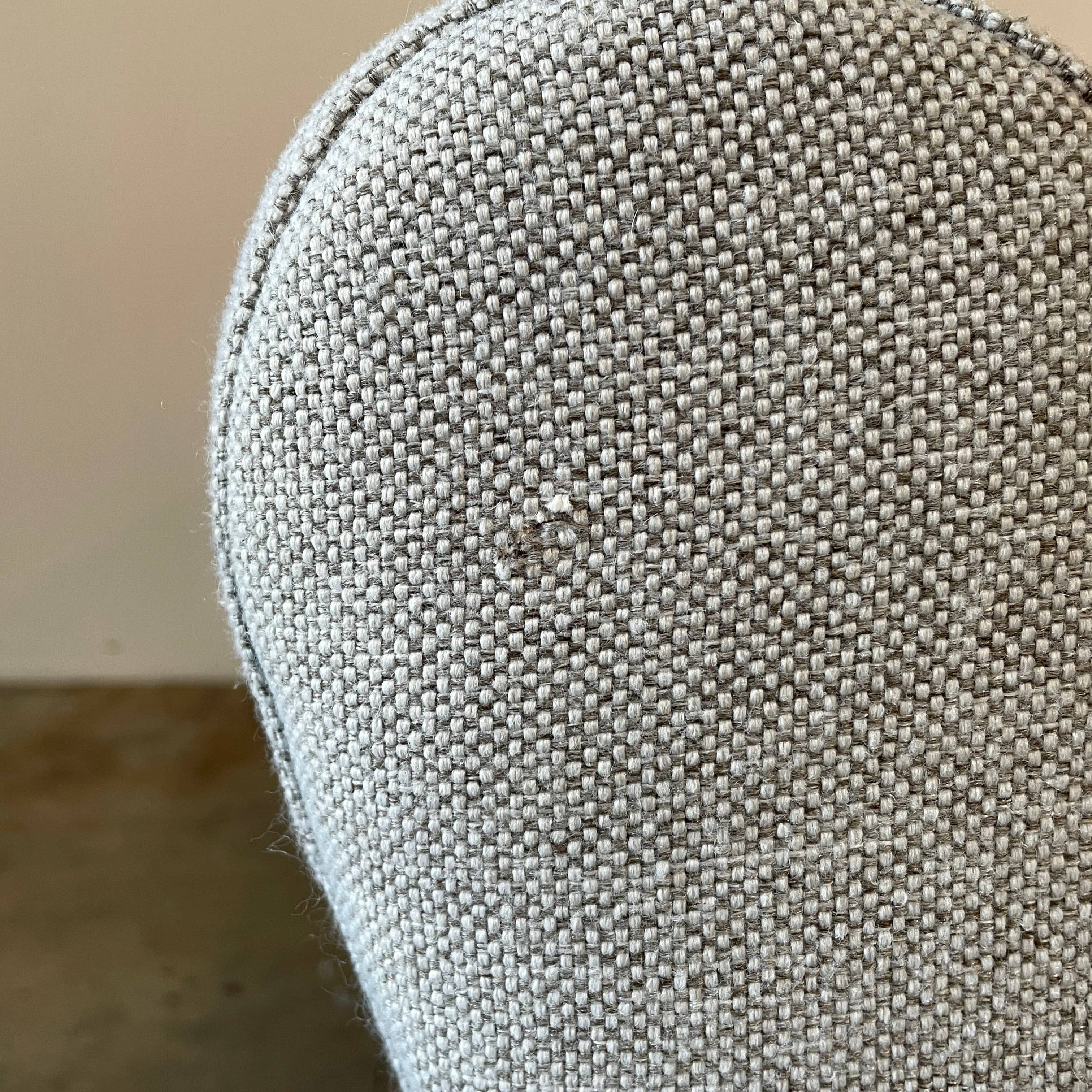 Modern curved Ligne Roset Yang Sectional sofa in durable wool fabric, isolated on a white background.