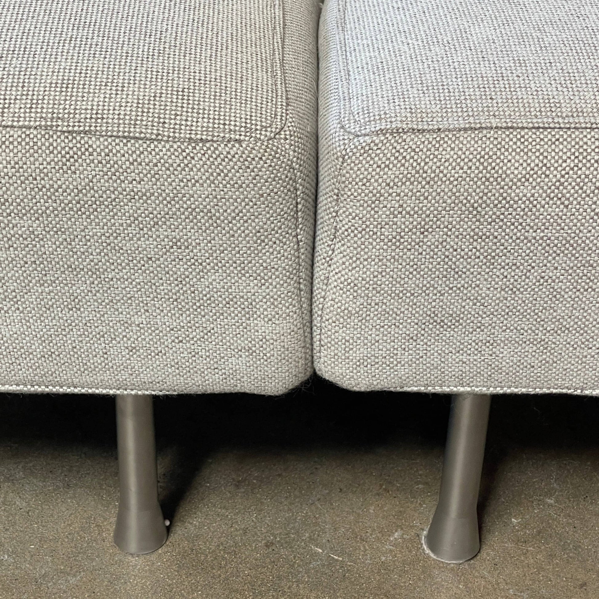 Modern curved Ligne Roset Yang Sectional sofa in durable wool fabric, isolated on a white background.