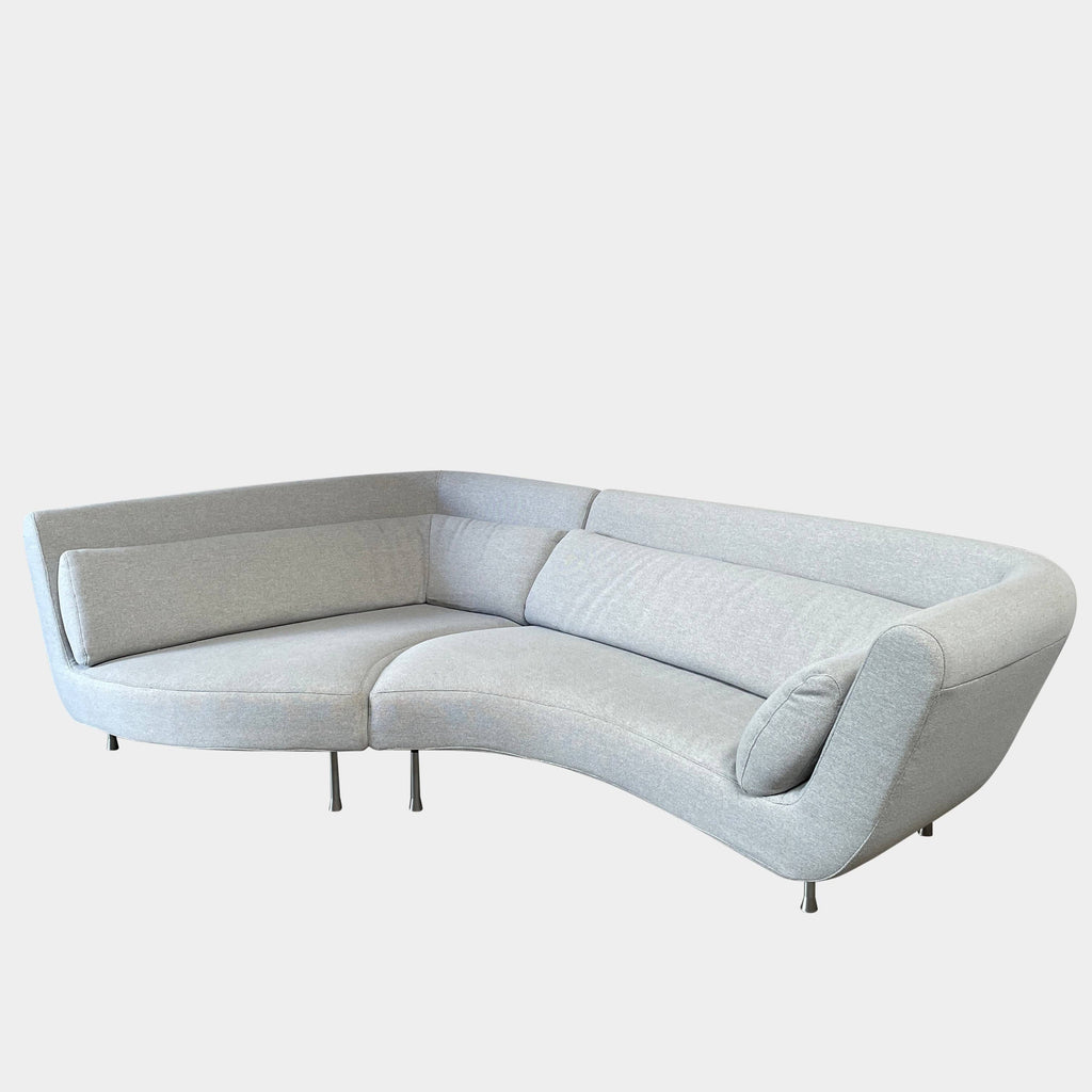 Modern curved Ligne Roset Yang Sectional sofa in durable wool fabric, isolated on a white background.