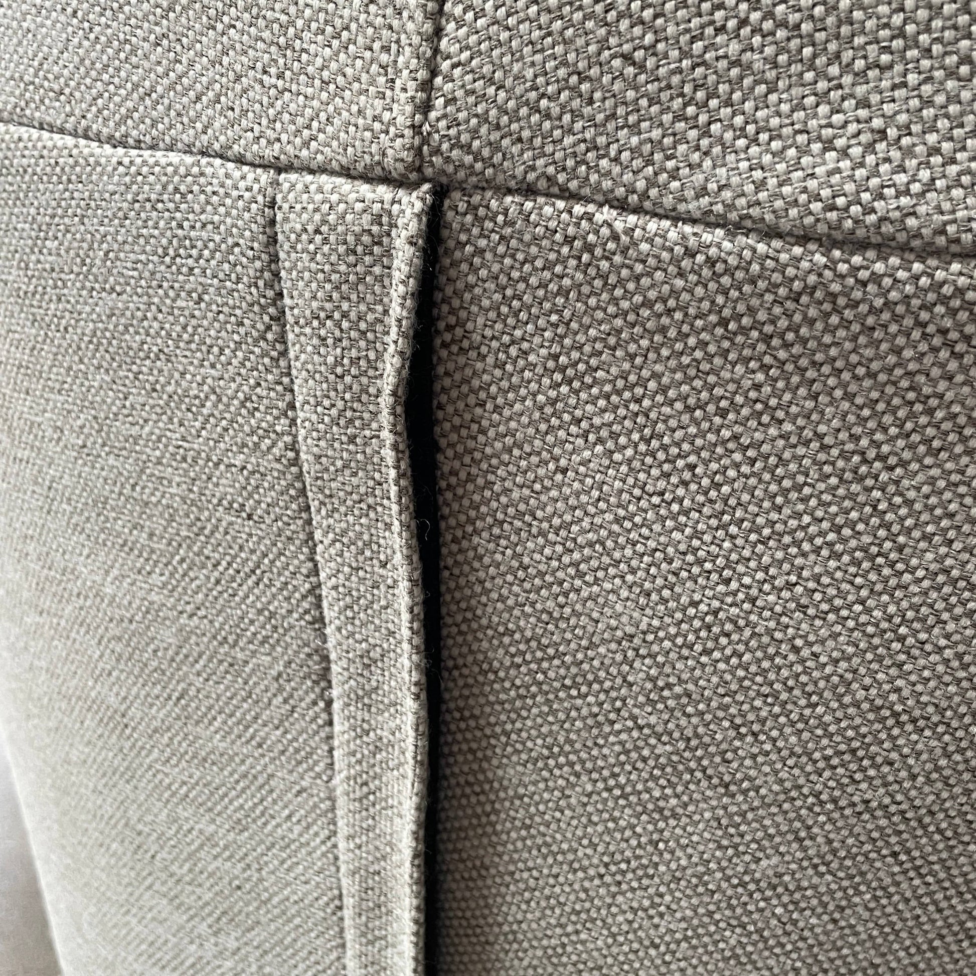 Modern curved Ligne Roset Yang Sectional sofa in durable wool fabric, isolated on a white background.