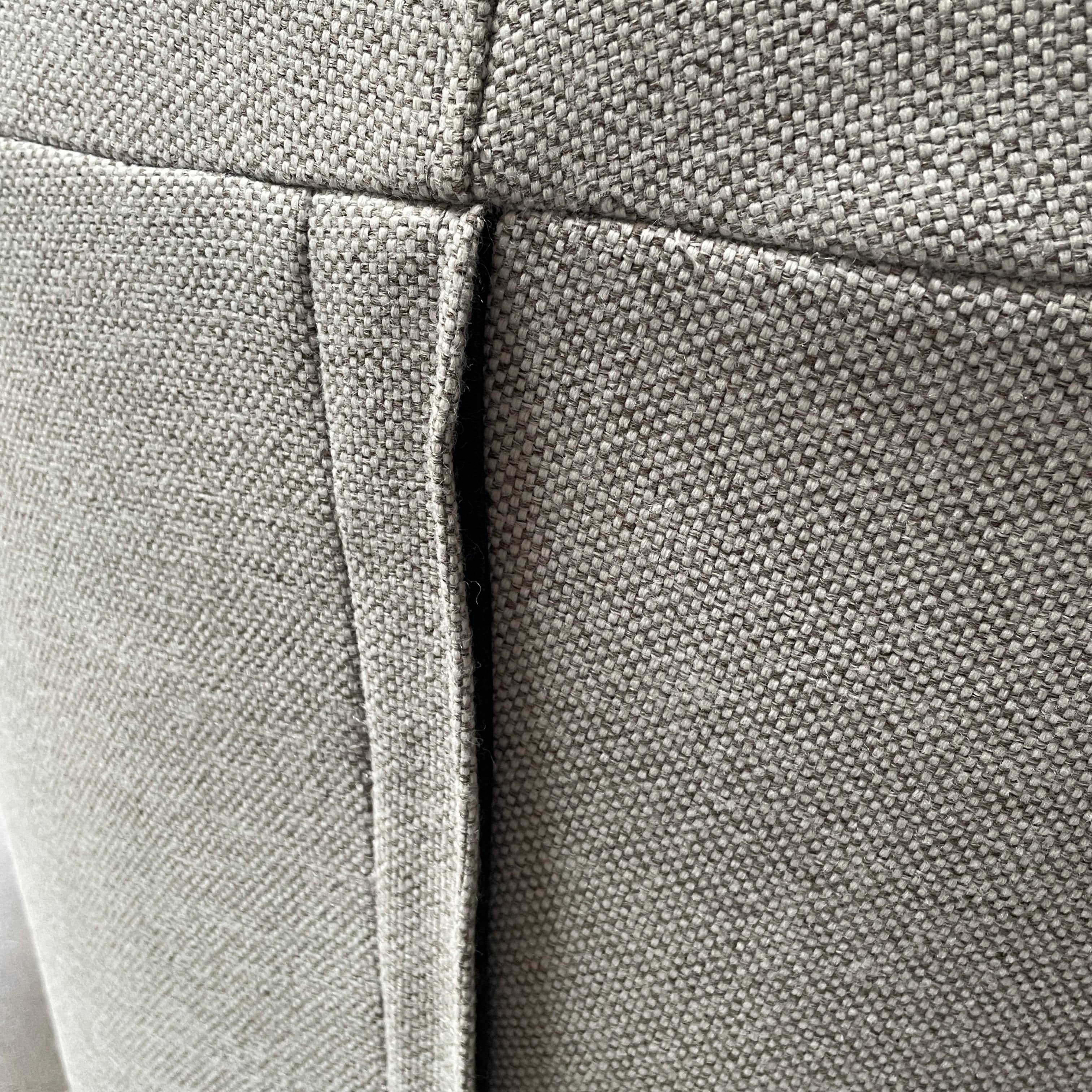 Modern curved Ligne Roset Yang Sectional sofa in durable wool fabric, isolated on a white background.