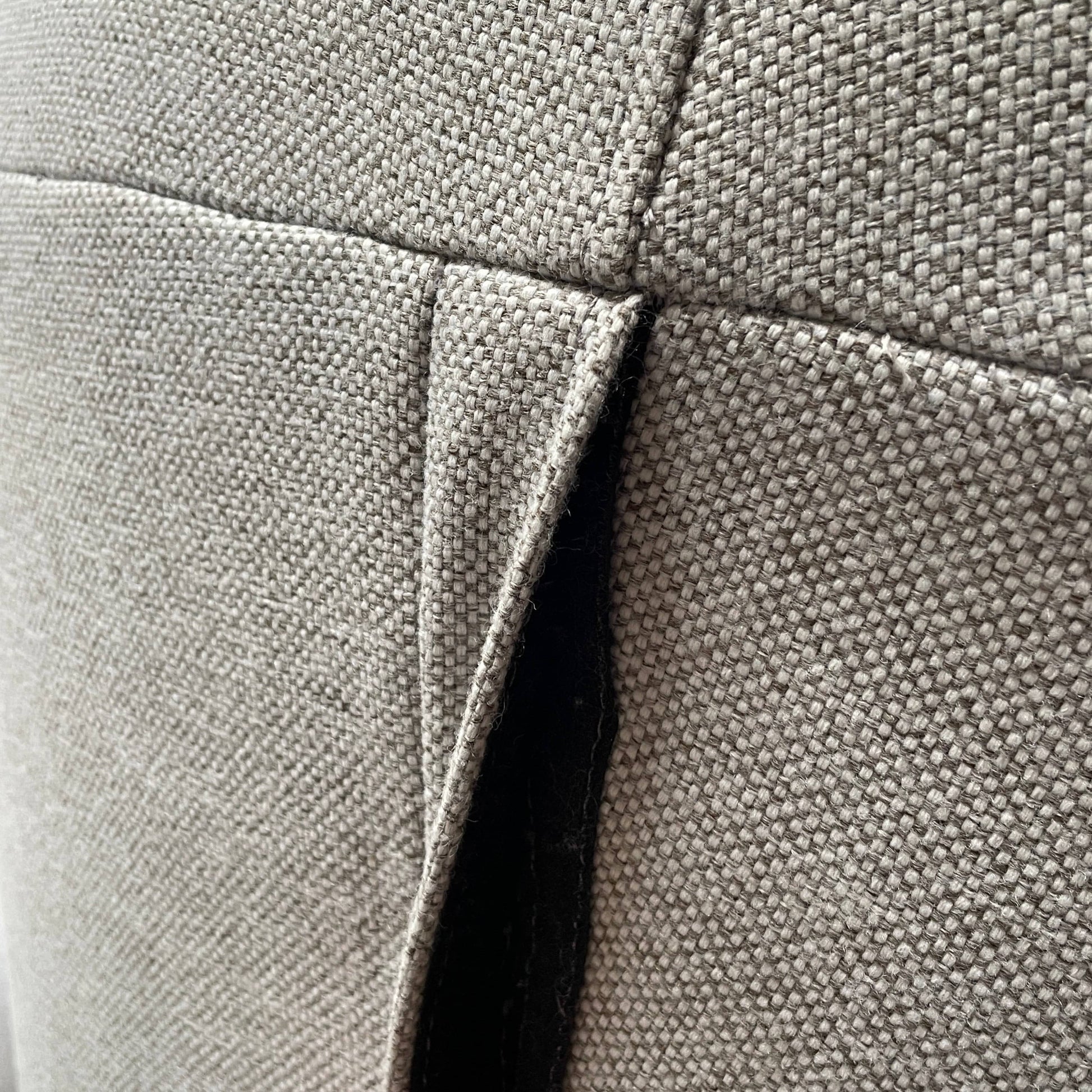 Modern curved Ligne Roset Yang Sectional sofa in durable wool fabric, isolated on a white background.