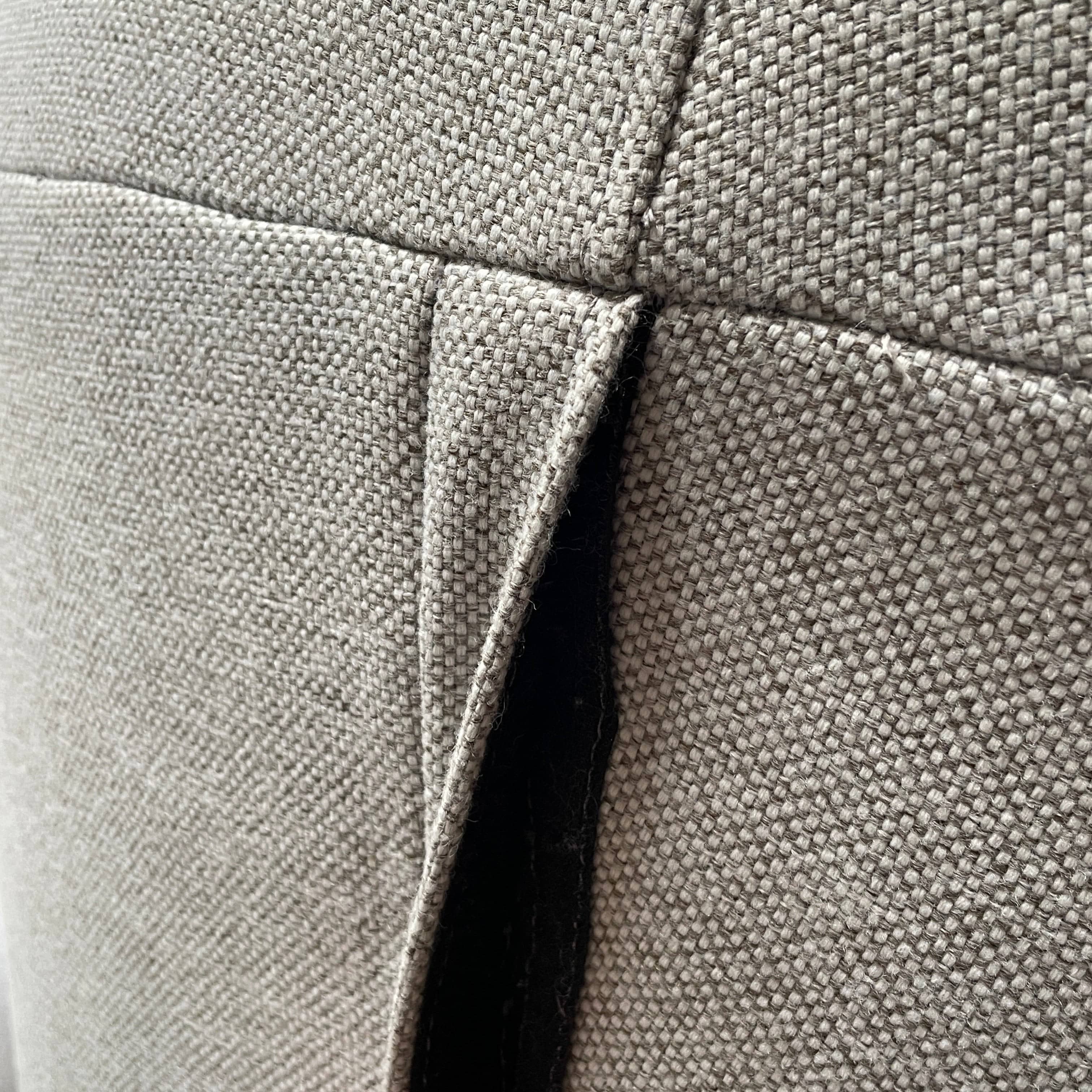 Modern curved Ligne Roset Yang Sectional sofa in durable wool fabric, isolated on a white background.