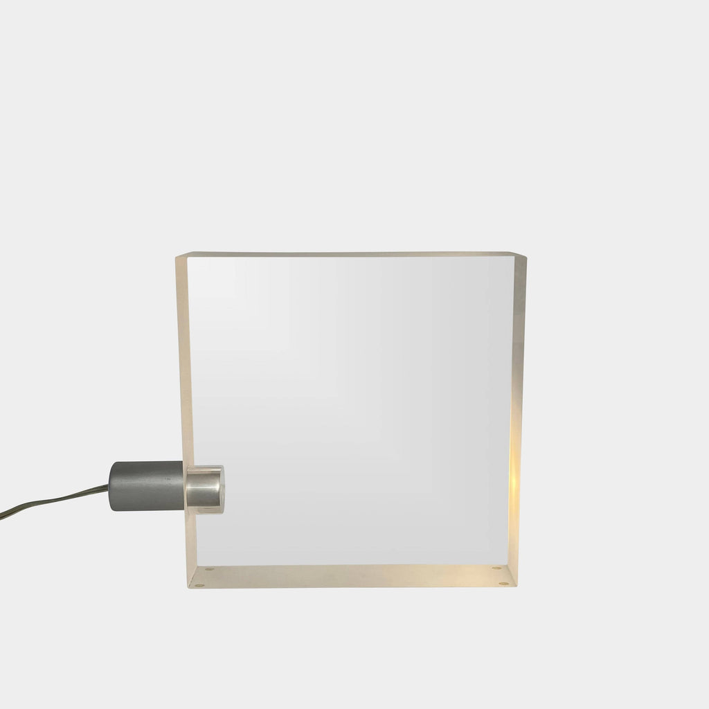 The Yamagiwa ToFU Table Lights, designed by Tokujin Yoshioka, are stylish square metal lamps featuring an innovative wire attachment.