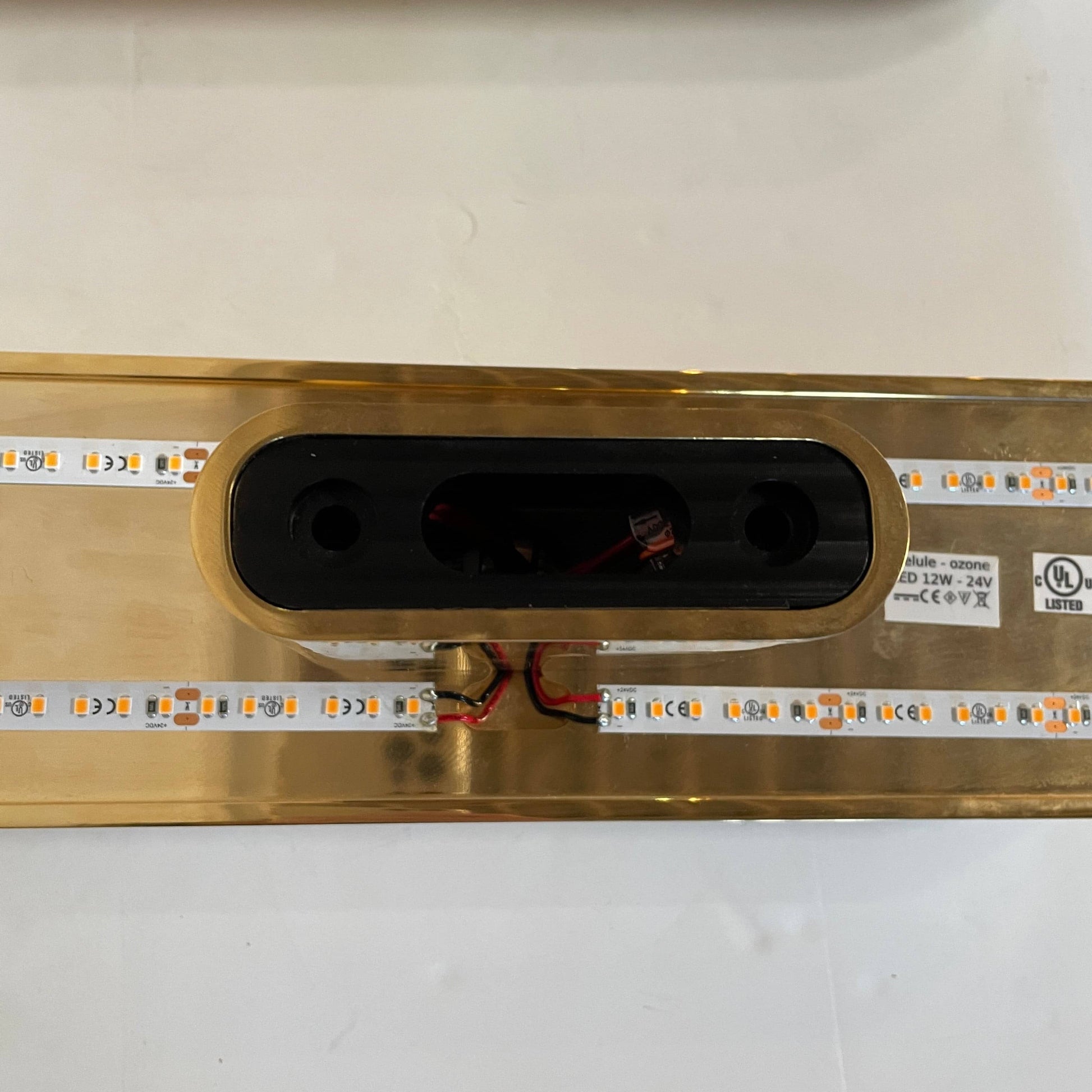 A pair of Ozone Gélule wall sconces on a white background, offering timeless elegance and sophisticated lighting solutions.