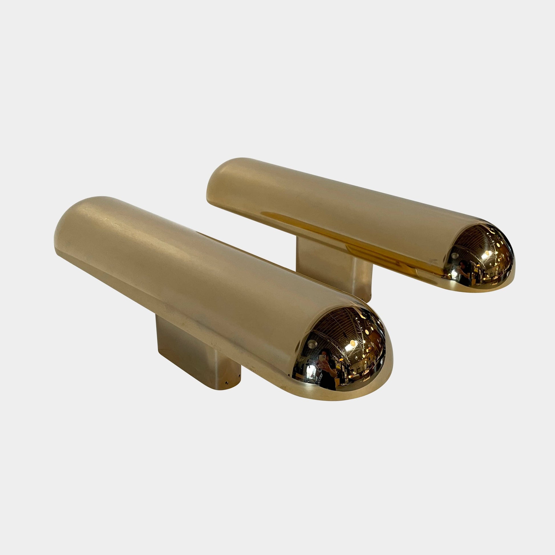 A pair of Ozone Gélule wall sconces on a white background, offering timeless elegance and sophisticated lighting solutions.