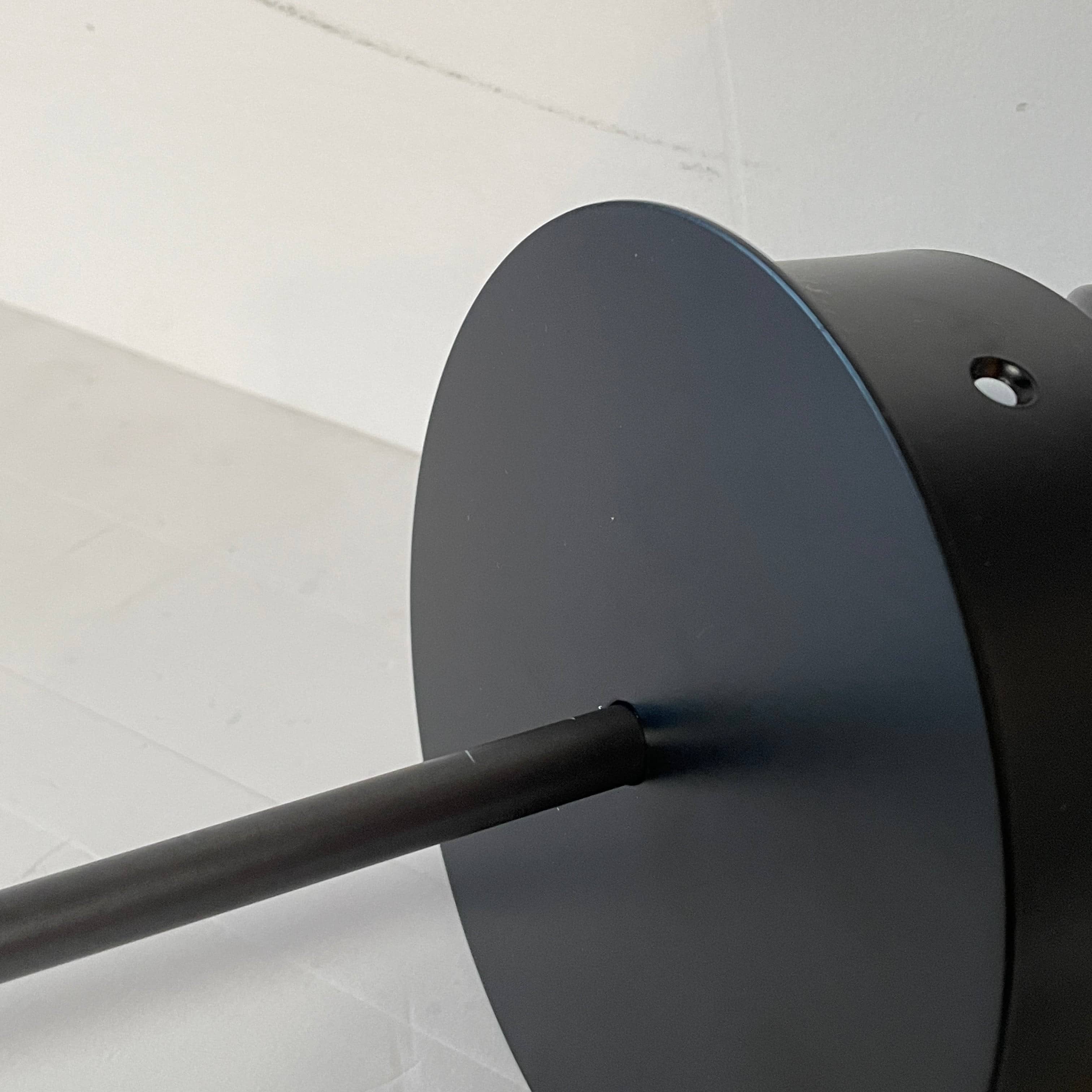 A Giopato & Coombes Softspot Pendant light hanging from a ceiling.