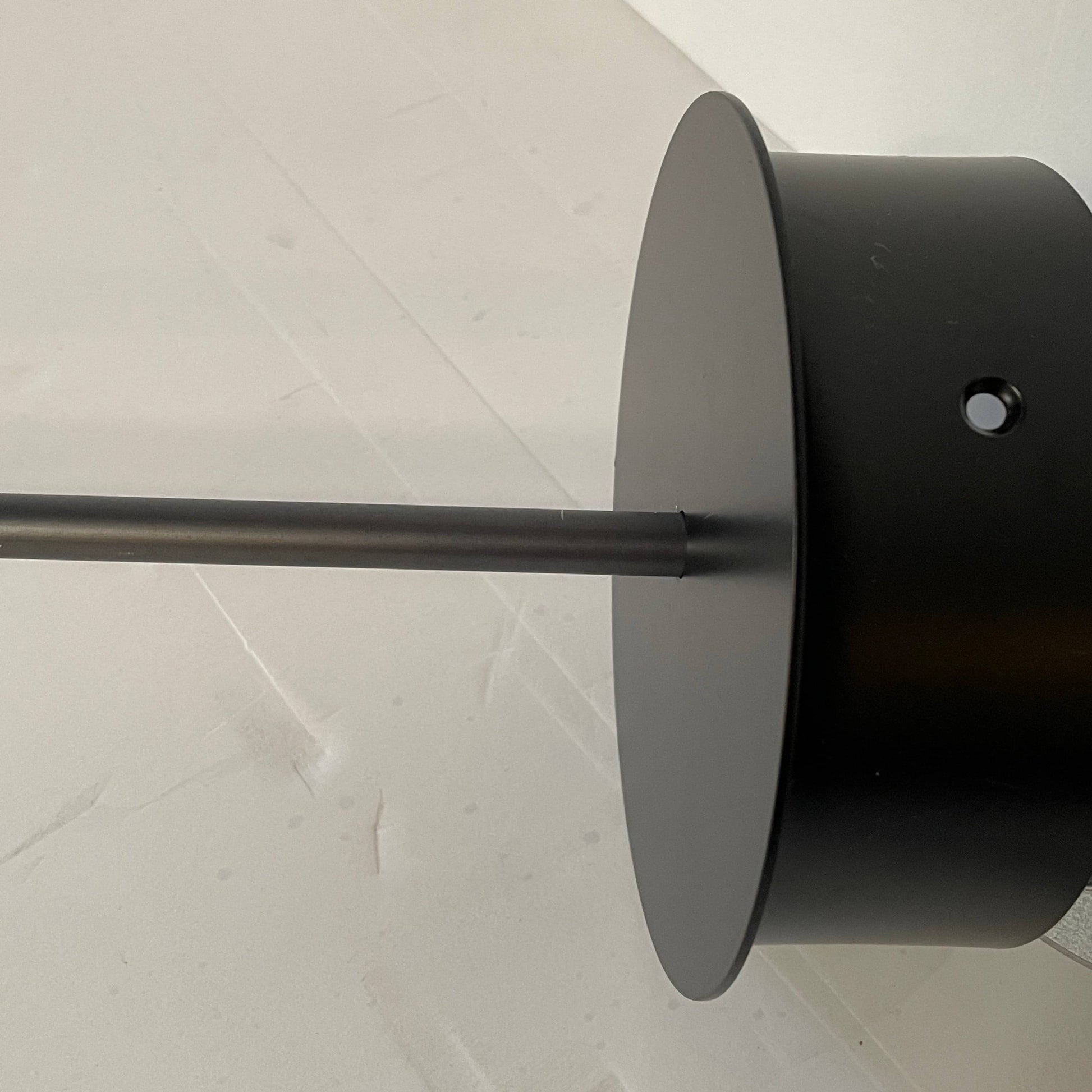 A Giopato & Coombes Softspot Pendant light hanging from a ceiling.