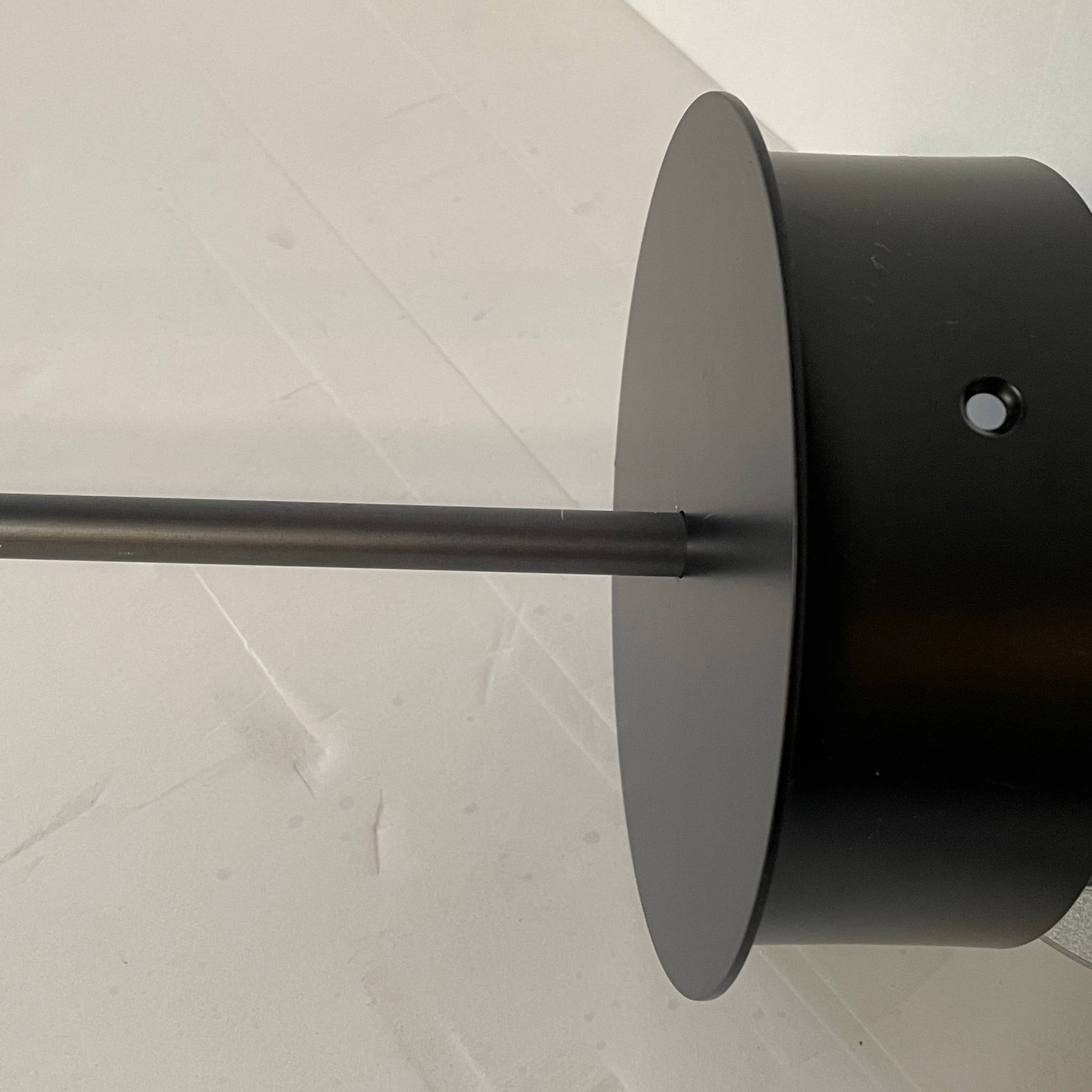 A Giopato & Coombes Softspot Pendant light hanging from a ceiling.