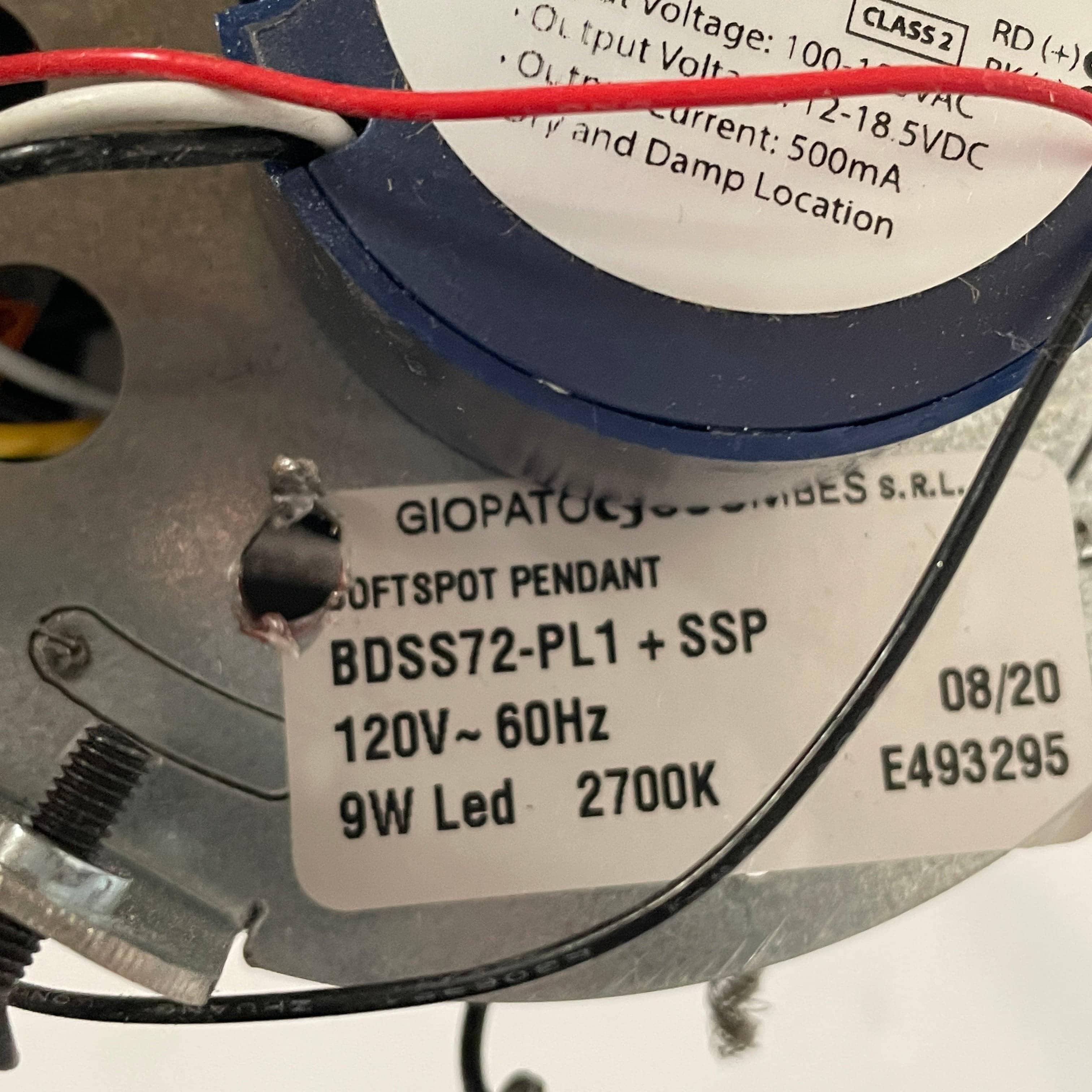 A Giopato & Coombes Softspot Pendant light hanging from a ceiling.