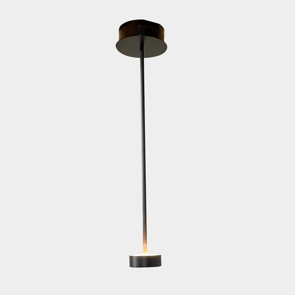 A Giopato & Coombes Softspot Pendant light hanging from a ceiling.